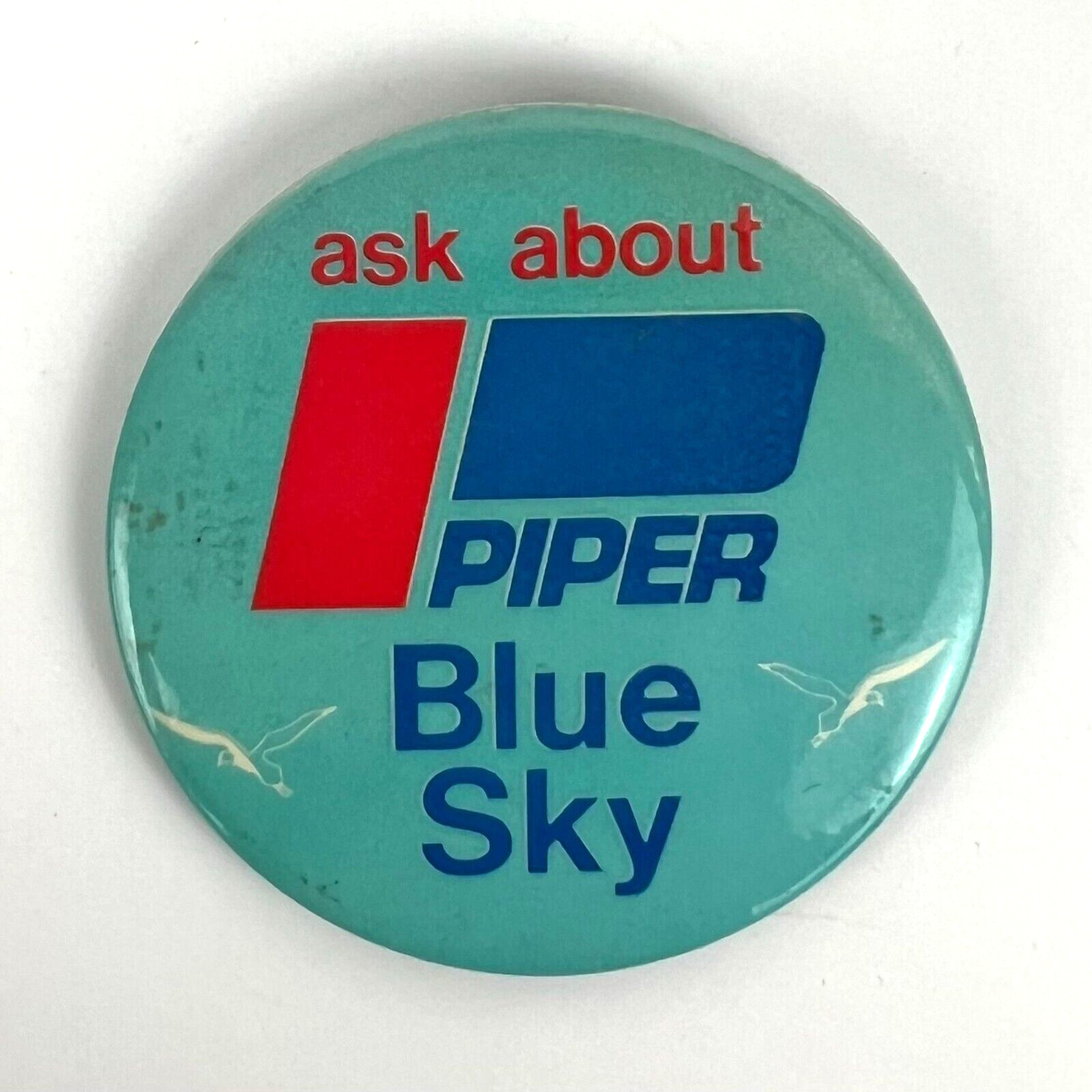 Ask About Piper Blue Sky Vintage Pinback Button Advertisement Flair