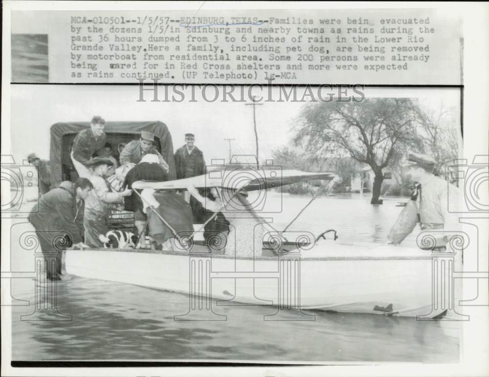 1957 Press Photo Family being evacuated from flooded home in Edinburg, Texas
