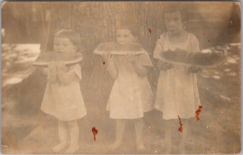 1910s RPPC Real Photo Postcard Three Children Eating Large Slices of Watermelon