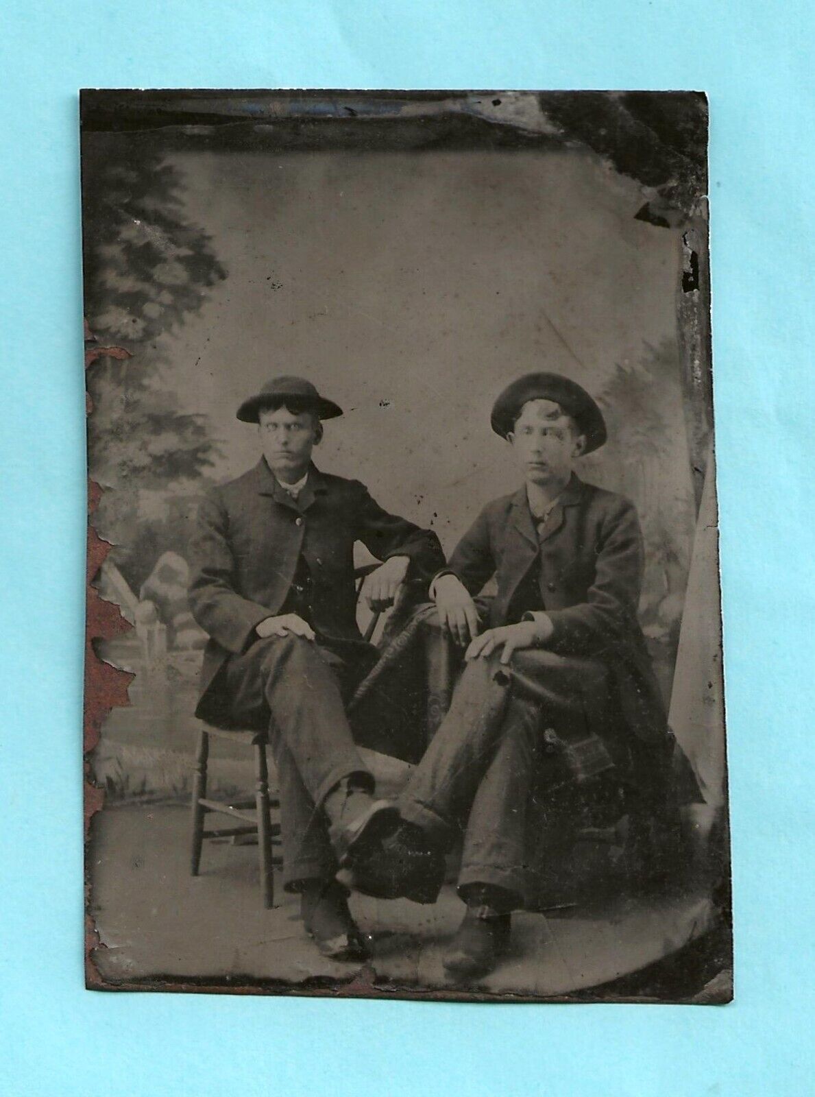 Tintype.  Two handsome young men hanging out.   Legs touching.