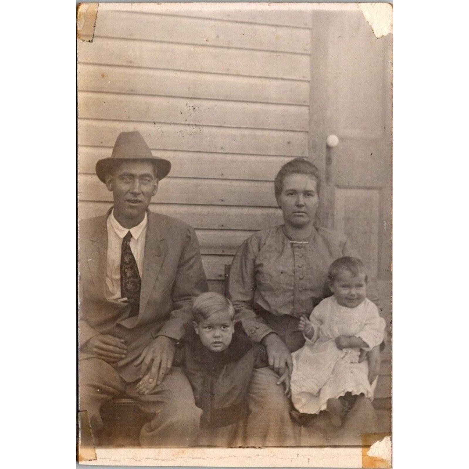 RPPC Family Portrait Man Woman and Children Azo Vintage Postcard Real Photo