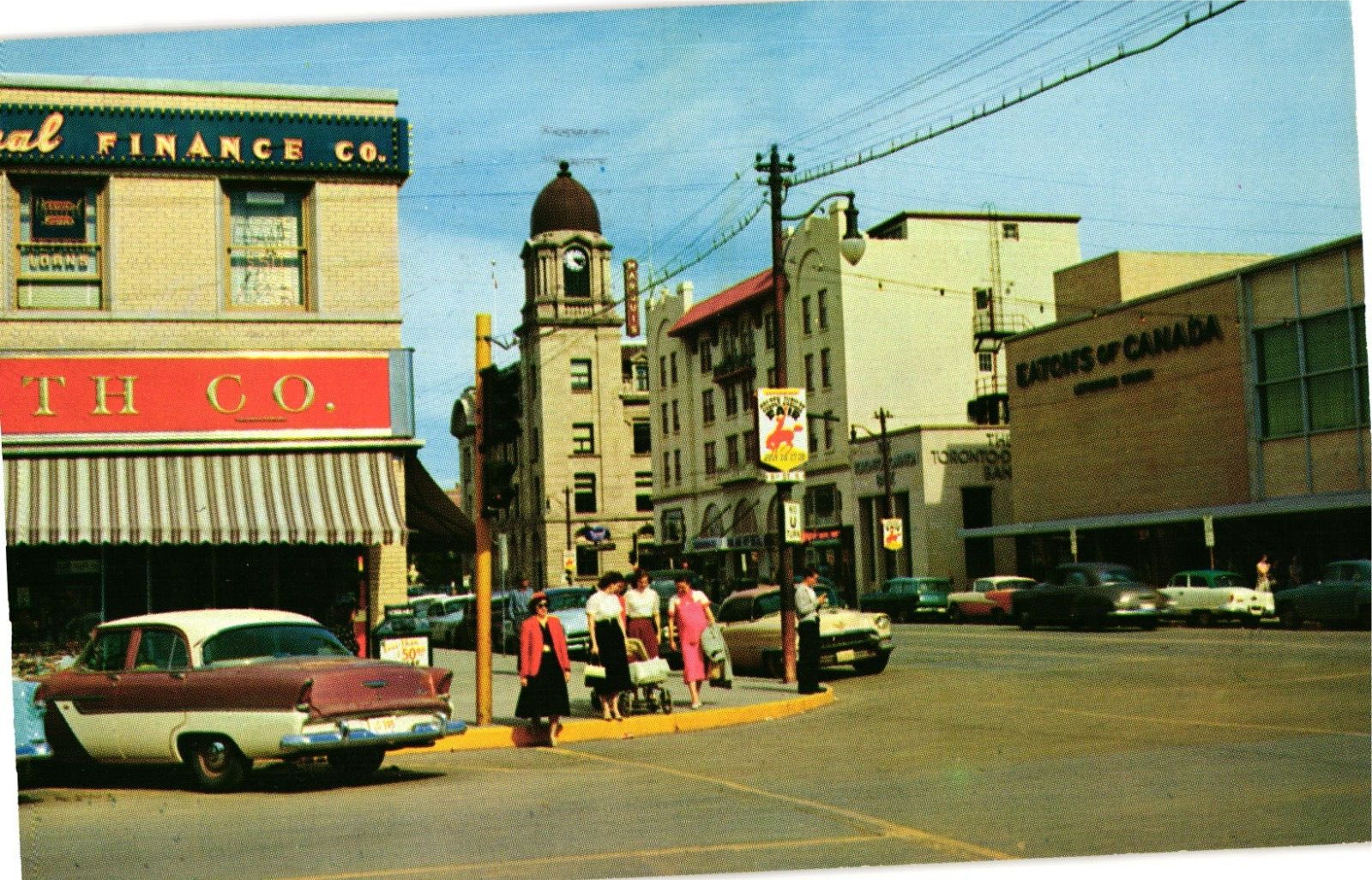 Fourth Ave Shops Cars Pedestrians Lethbridge Alberta Canada Postcard 1950s