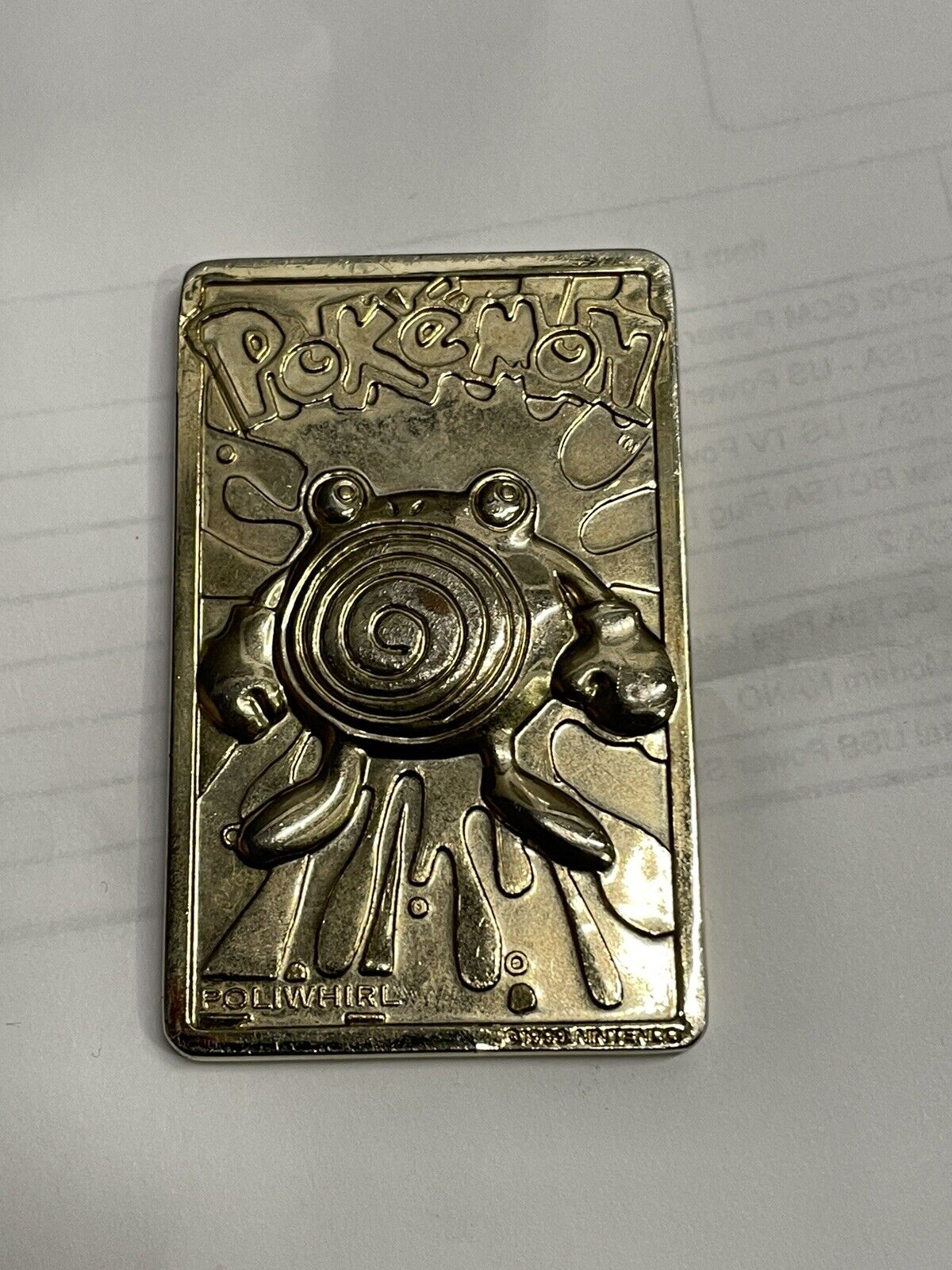 PoliWhirl Pokemon 1999 Nintendo Gold Toned Metal Bar Card