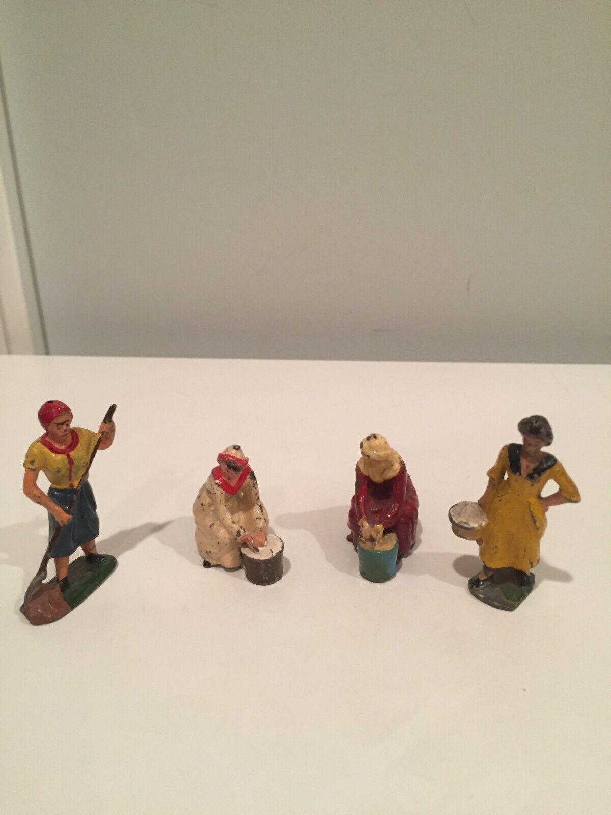 4 Vintage metal miniature working women
