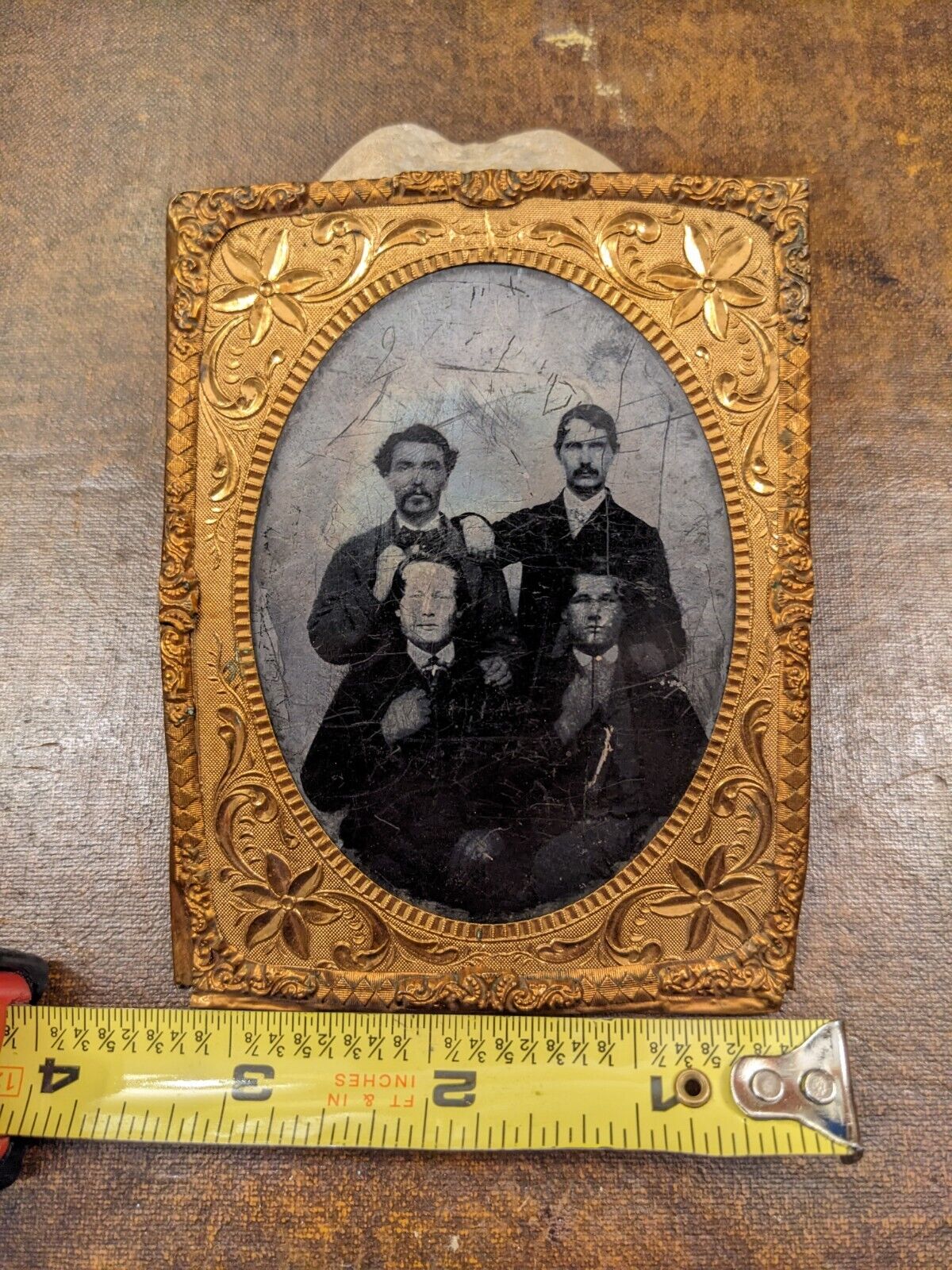 Mid 1800s larger tintype four nicely posed gentlemen with embossed metal frame