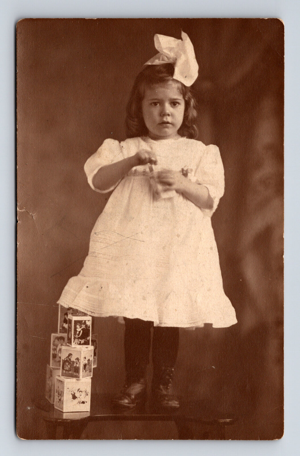 RPPC Portrait of Young Girl in White Summer Dress Toy Blocks Postcard