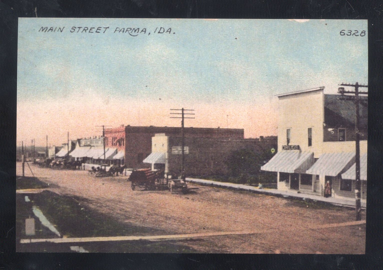 PARMA IDAHO DOWNTOWN DIRT STREET SCENE STORES HORSE & BUGGY POSTCARD COPY