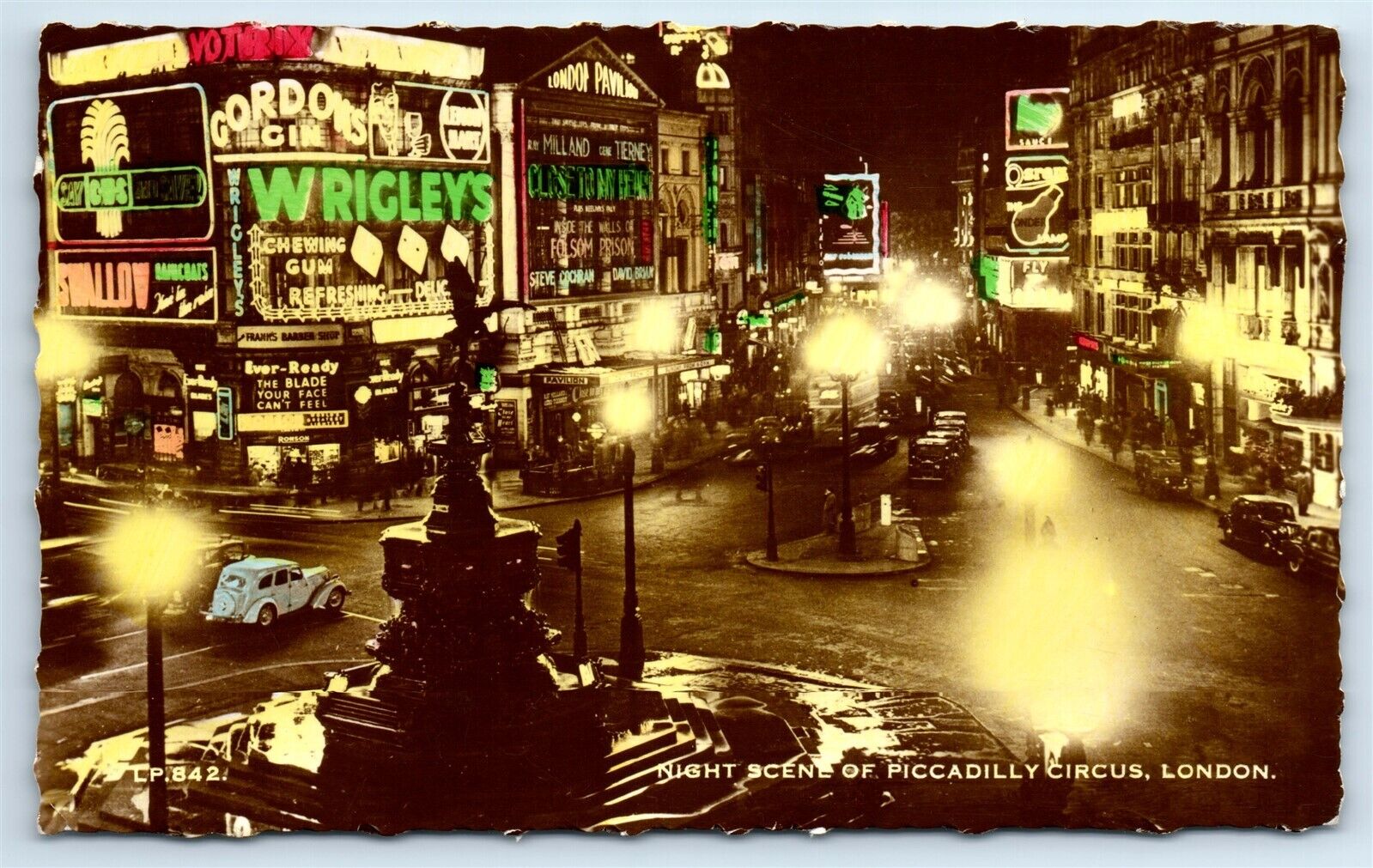 Postcard Night Scene of Piccadilly Circus, London hand-colored 1957 RPPC H186