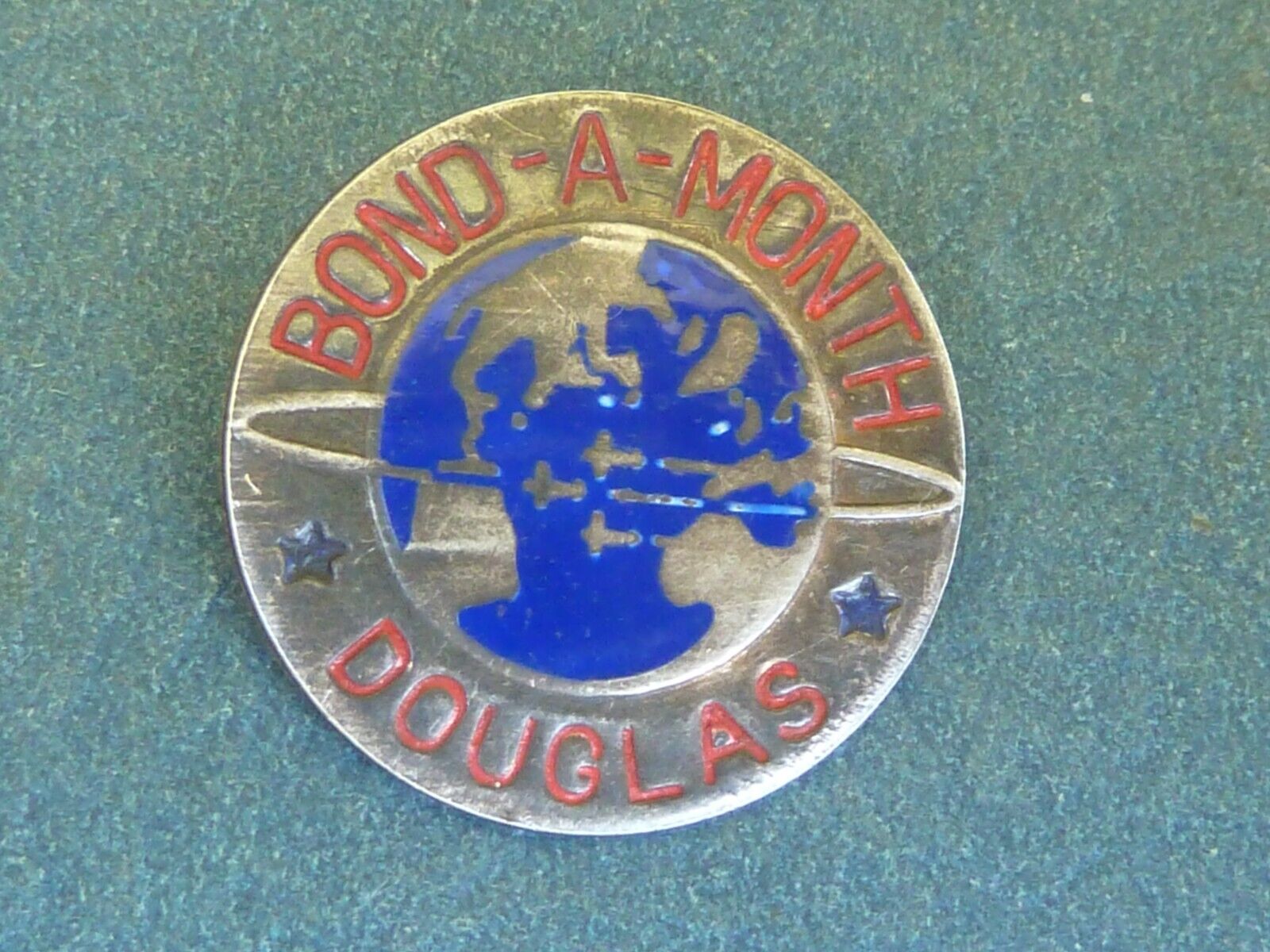 WWII Douglas Aircraft Bond A Month pin back, missing pin