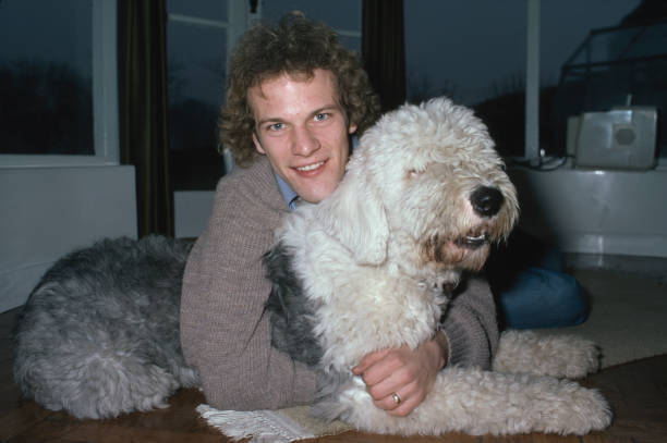 Scottish footballer Andy Gray with the family dog Ben circa May 1978 Old Photo