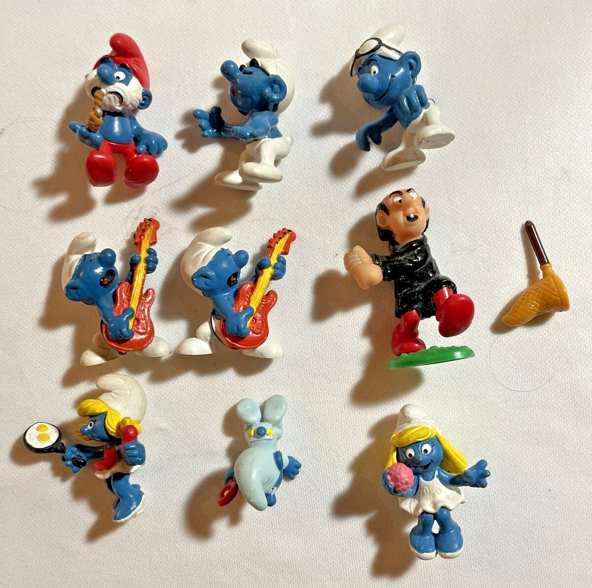 Vintage Smurfs Set Of 9. See All Pics One Needs Net Fixed