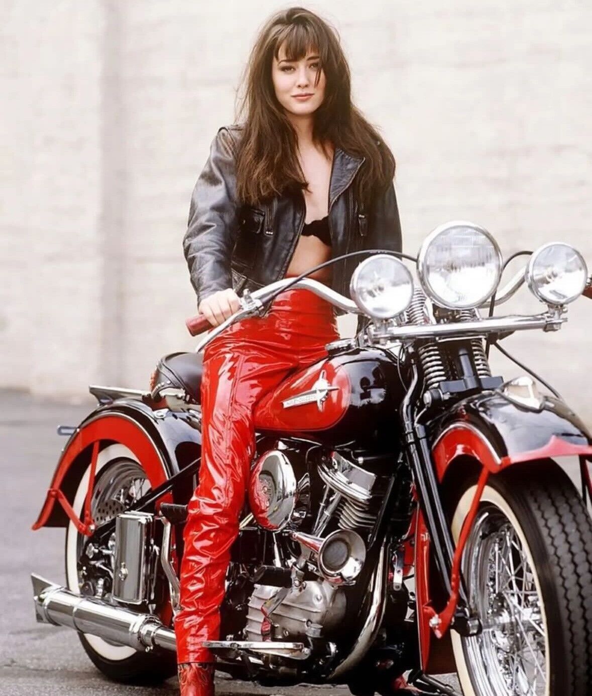 SHANNON DOHERTY - STRADDLING A MOTORCYCLE 