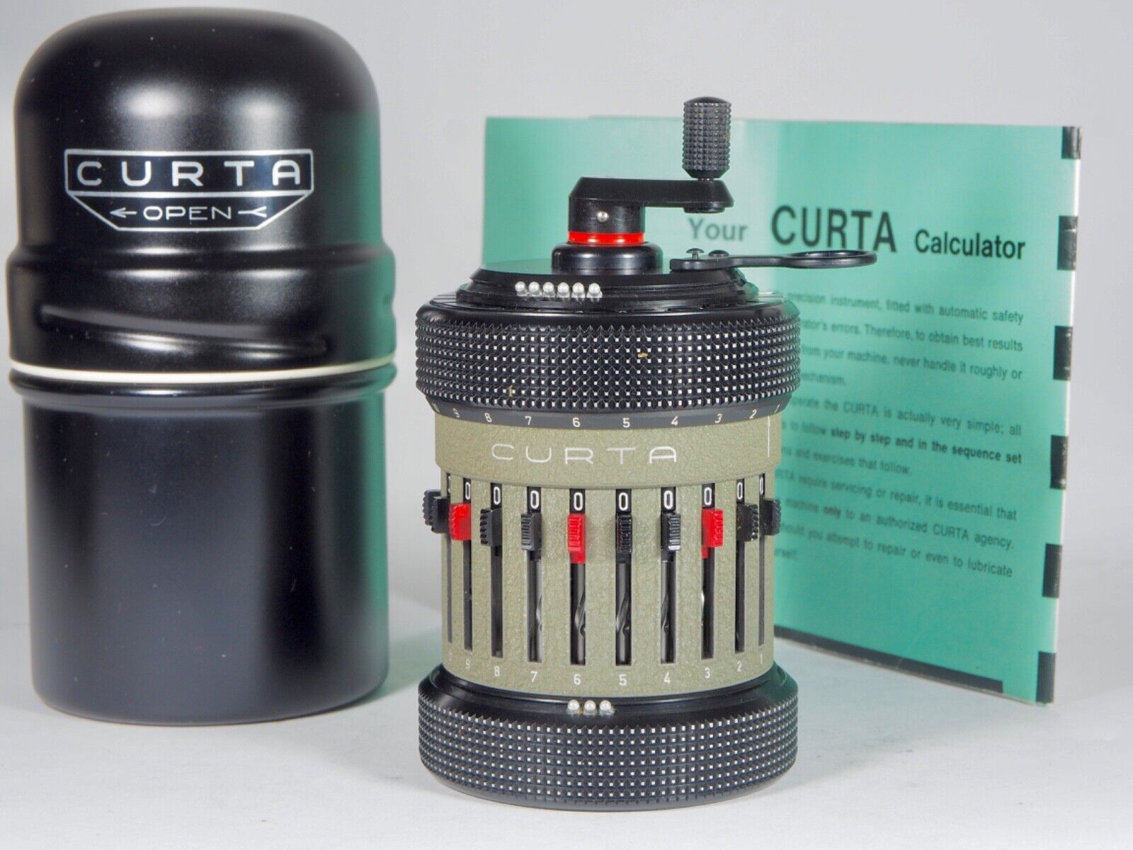 Mint Curta Calculator 1963 Type 2 w/can, manuals likely unused, perfect function