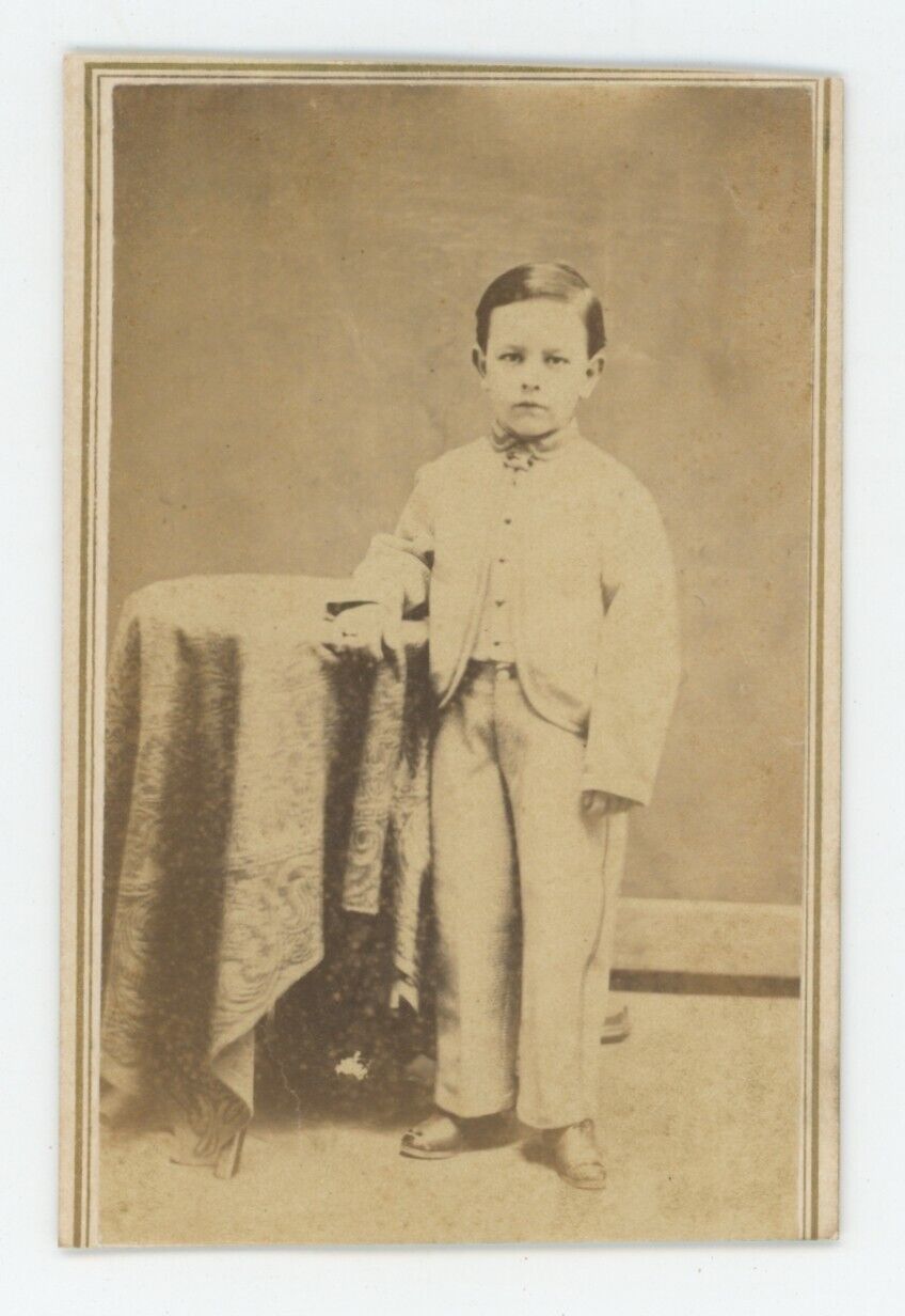 Antique CDV Circa 1860s Handsome Young Boy Standing Next to Table in Suit