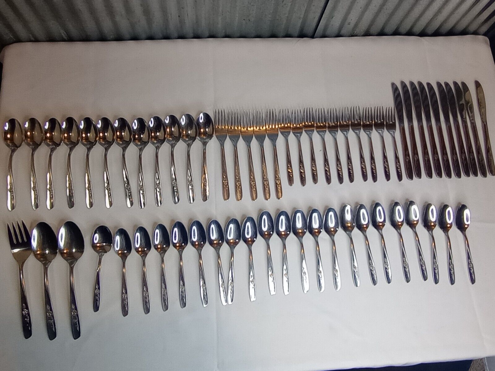 Vintag/  MCM. 50 Piece Oneida Stainless Flatware Set.. With Rose