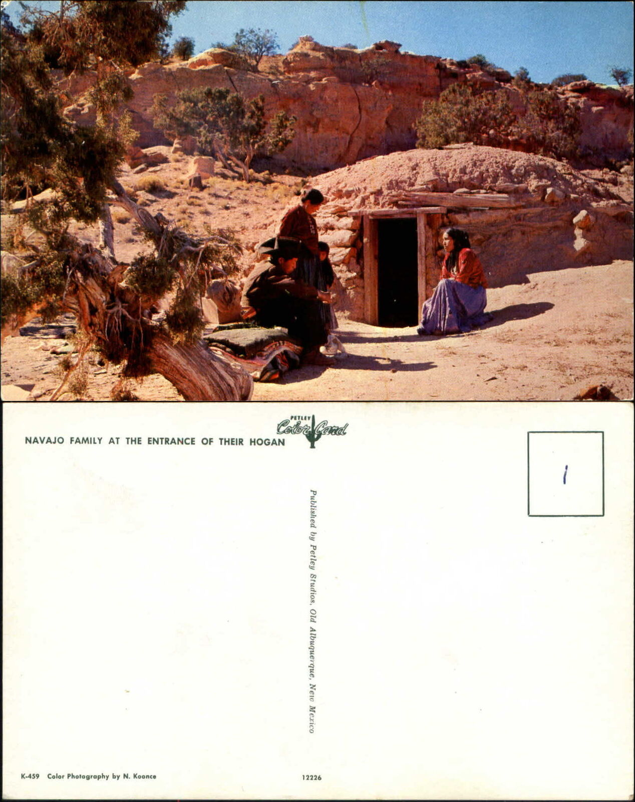 Navajo family at entrance to Hogan Native American Indian desert 1960s postcard