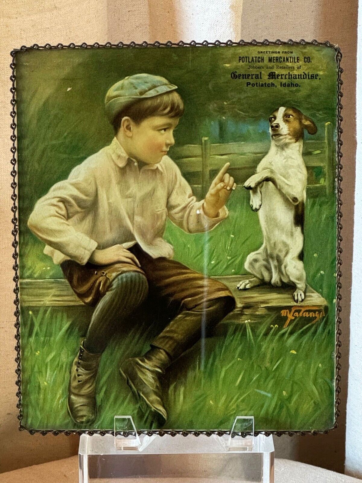 ANTIQUE POTLATCH MERCANTILE CO. IDAHO 1917 CALENDAR PRINT-UNDER-GLASS; BOY & DOG