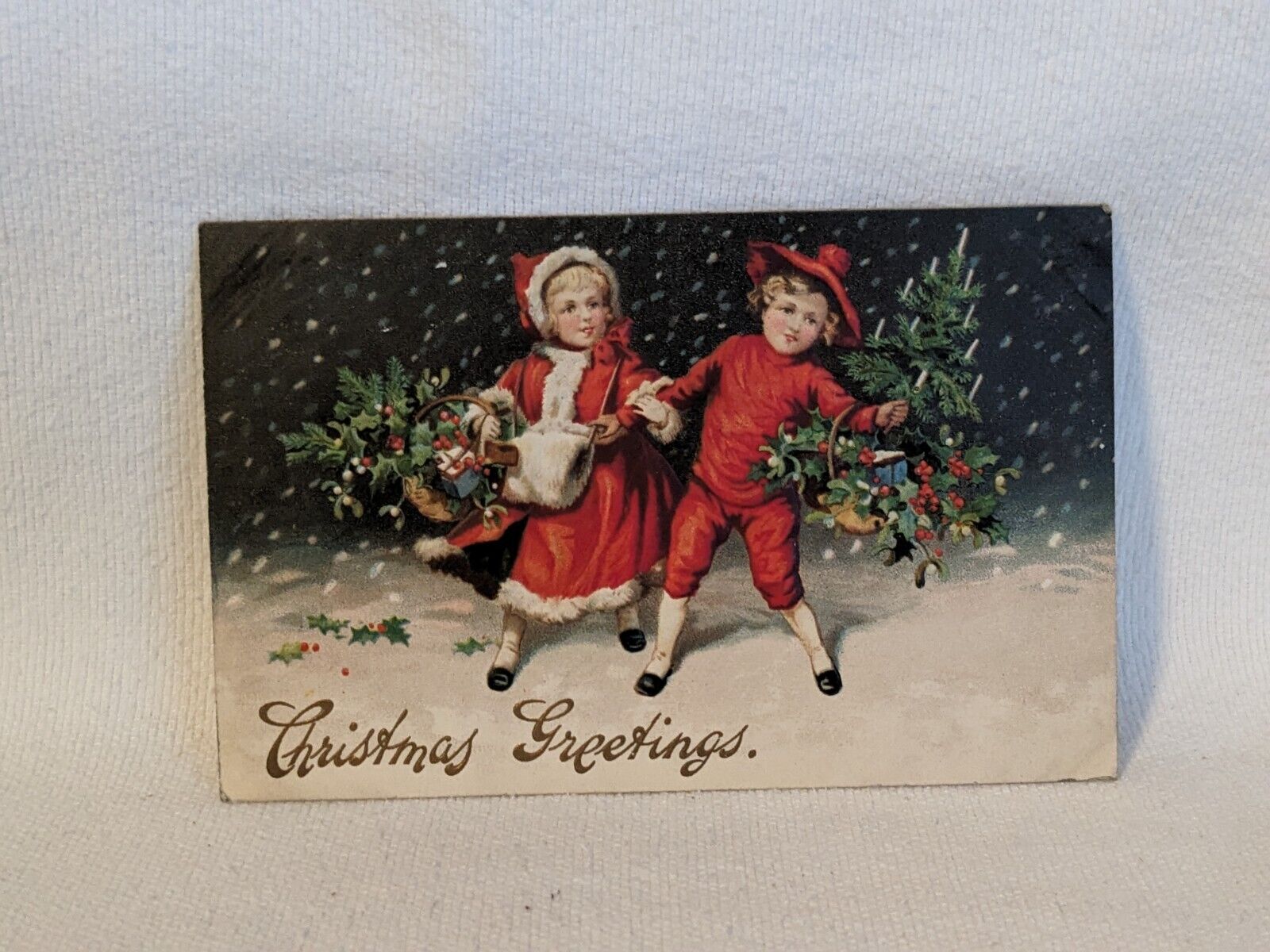 Postcard Christmas Greetings Boy and Girl in Red with Baskets Embossed 1912 A20