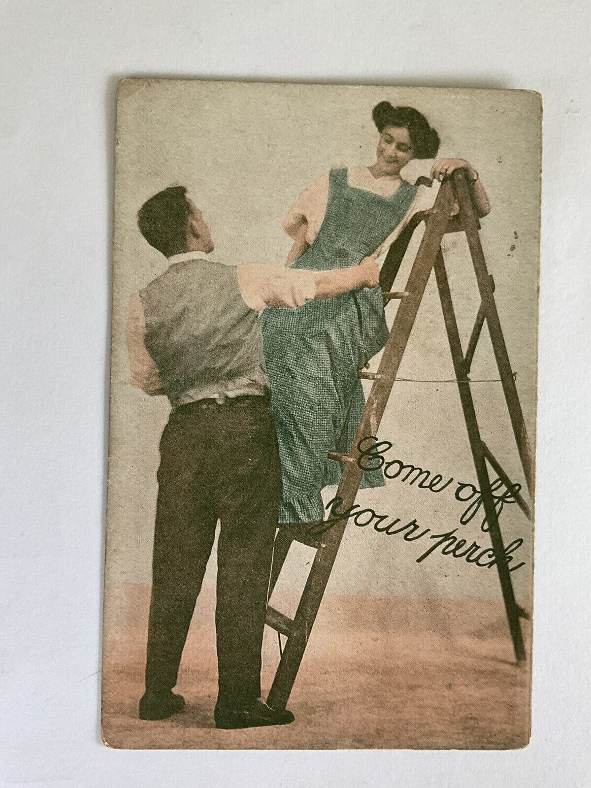 Romance~couple~man holds lady leaning at top of ladder~Come off your perch