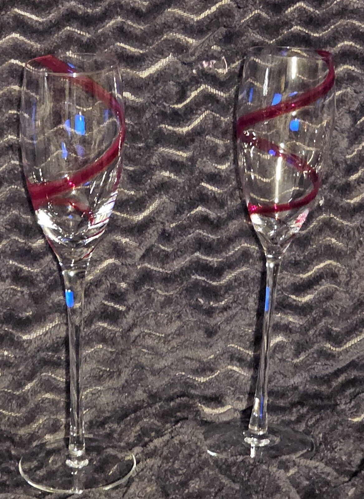Two Pier 1 Imoort Red Swirl Champagne Flute