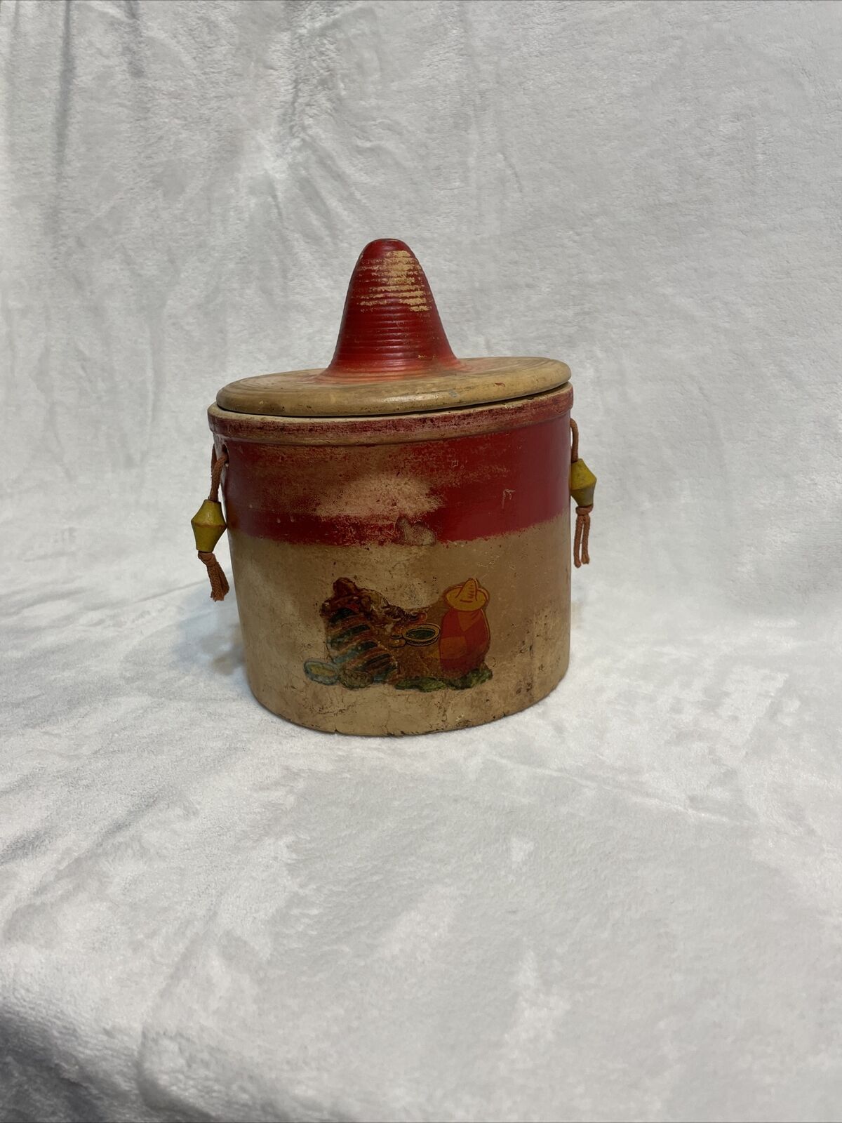 Vtg Pottery red hat lid String Handles 2 guys on front USA