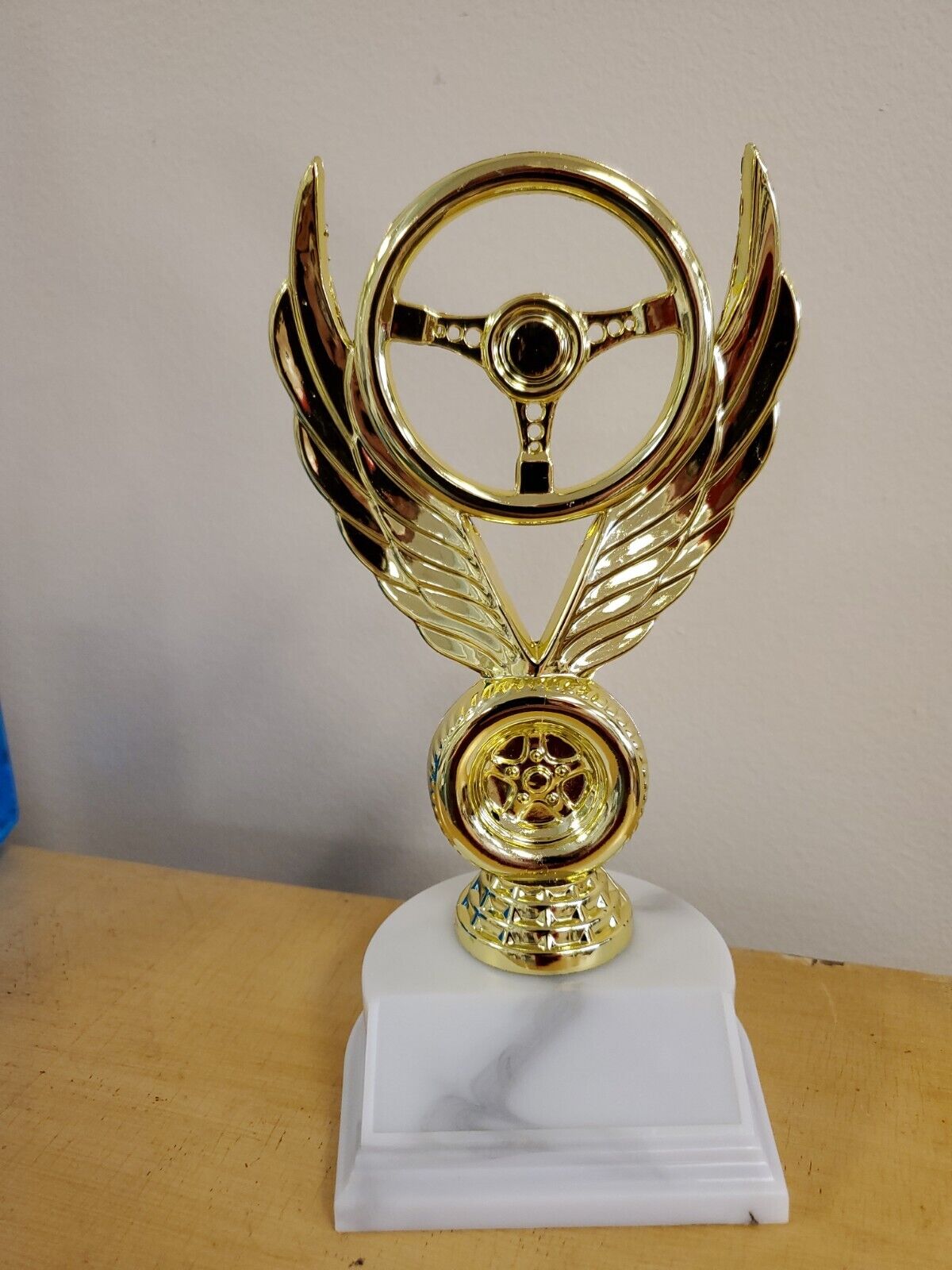 auto racing, car show, award or trophy winged wheel, about 7\