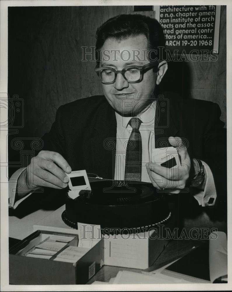 1968 Press Photo Harry A. Anthony Checks Photo Slides  - noa16819