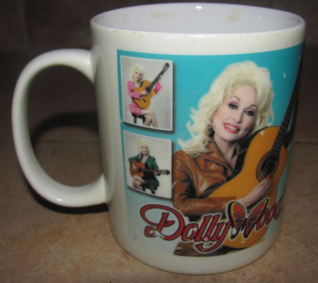 Dollywood Souvenir Coffee Mug. Wrap Around Image Dolly & Guitar. Good Condition