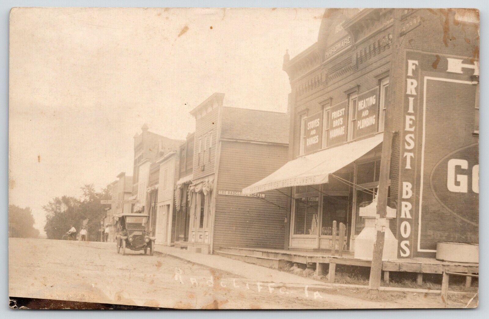 Radcliffe Iowa~Main Street~Friest Bros Hardware~Signal Newspaper~Car~1914 RPPC