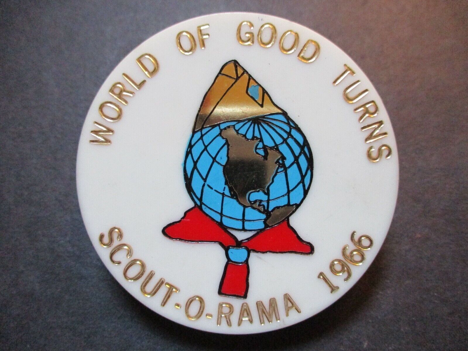 1966 World of Good Turns Scout-O-Rama plastic BSA neckerchief slide