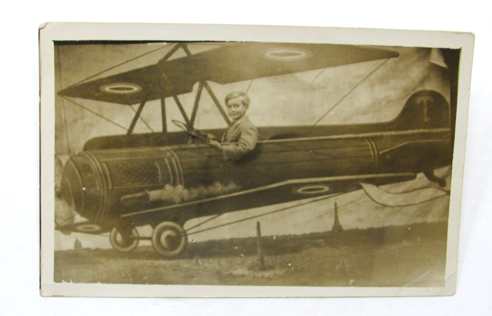 c1910 Handsome Little Boy with Excited Look Flying Biplane Studio RPPC Postcard