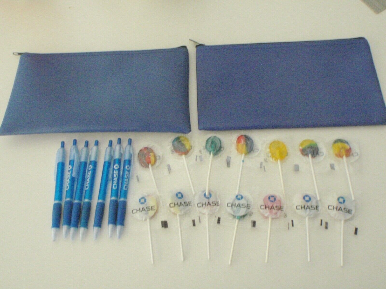 New CHASE BANK Blue Zipper Merchant Cash Bags (BLANK), 14 Candy Lollipops,7 Pens
