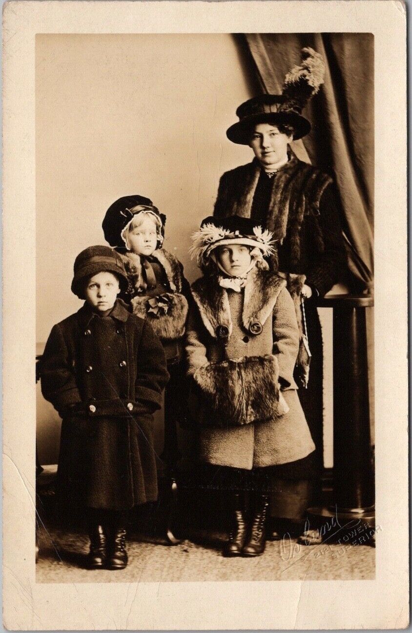 Vintage1910s Studio RPPC Photo Postcard Mother & Three Children in Winter Coats