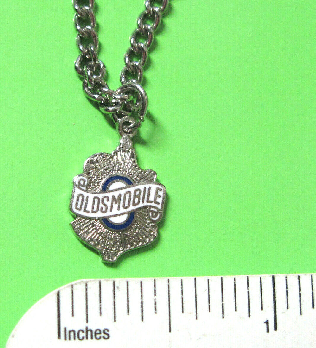 OLDSMOBILE- necklace , pendant GIFT BOXED silver tone