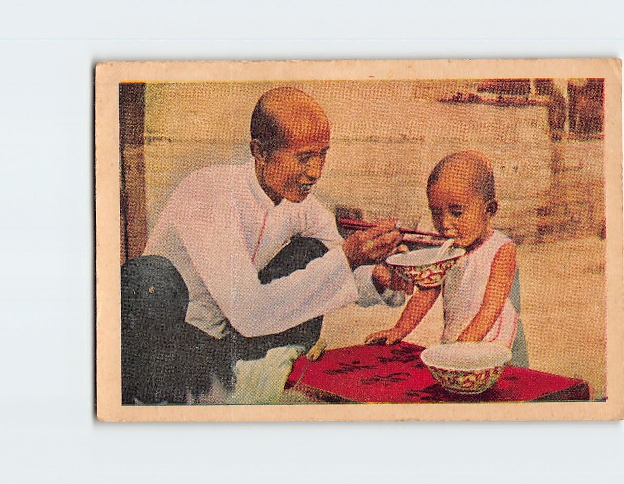 Postcard Man Feeding a Child