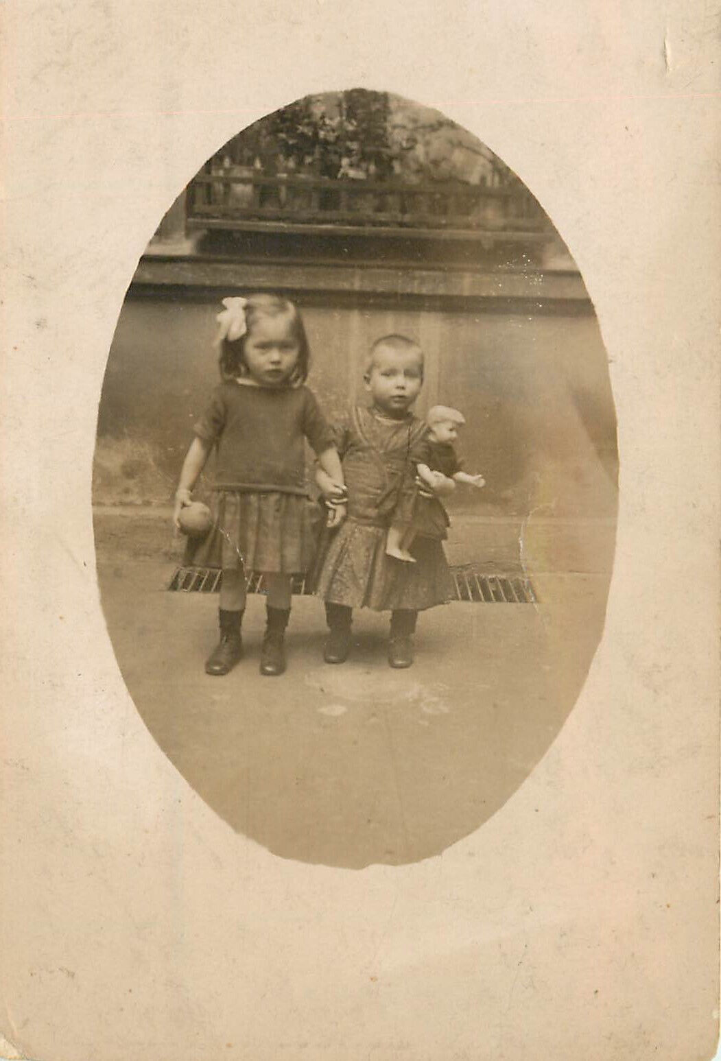 RPPC Vignette Postcard 2 Little Girls One With Ball The Other With Doll Europe