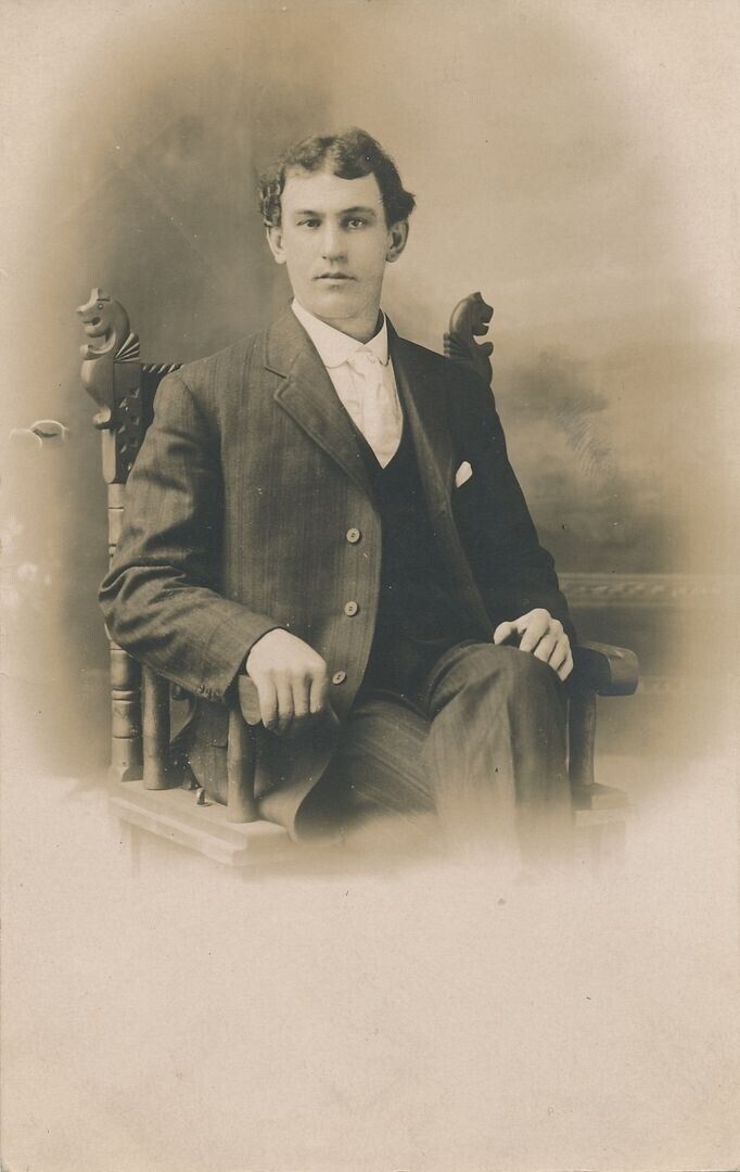 Young Seated Man Real Photo Postcard rppc