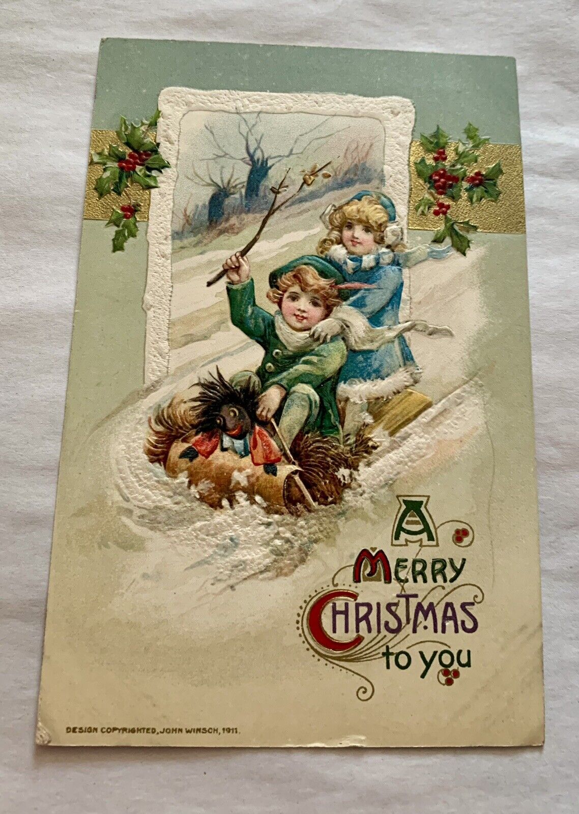 1911 John Winsch Christmas Postcard - Children Toboggan , Doll , Snowy