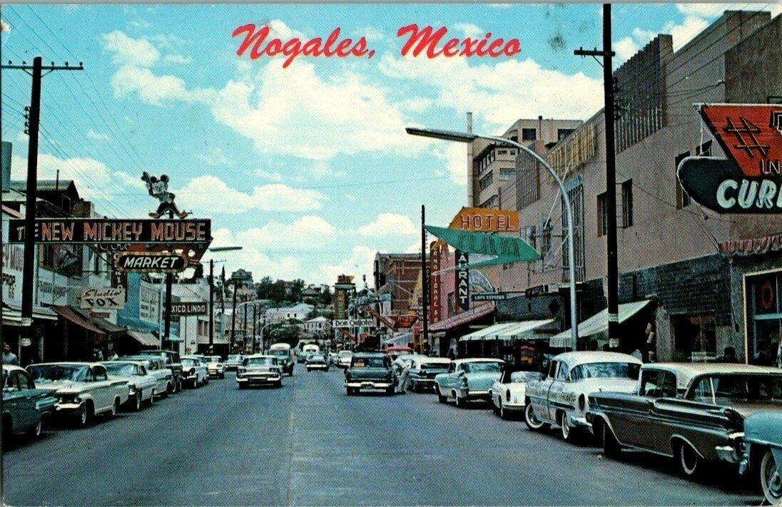 1950\'S. NOGALES, MEXICO. STREET VIEW. MICKEY MOUSE MARKET. POSTCARD. DC4