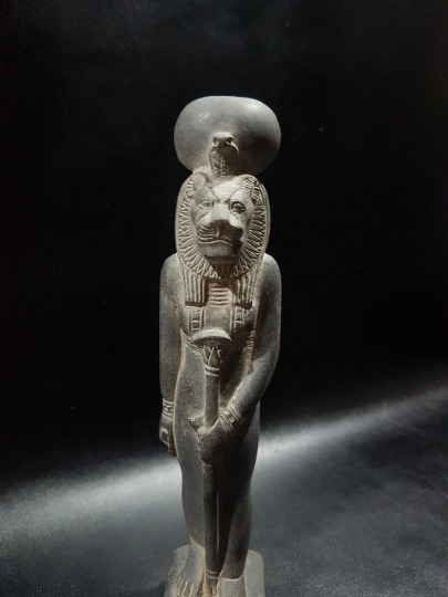 Old-fashioned Sekhmet Wearing the Sun Disk and holding the stick