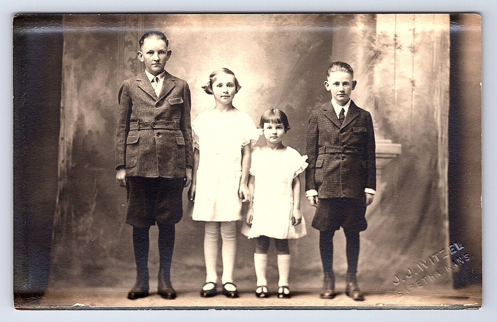 Postcard RPPC Four Children Posed, Marked as Sabetha, Kansas Photographer