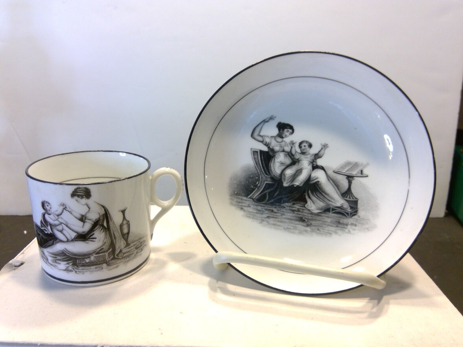 Antique British Black Transferware Cup & Saucer - Woman & Child