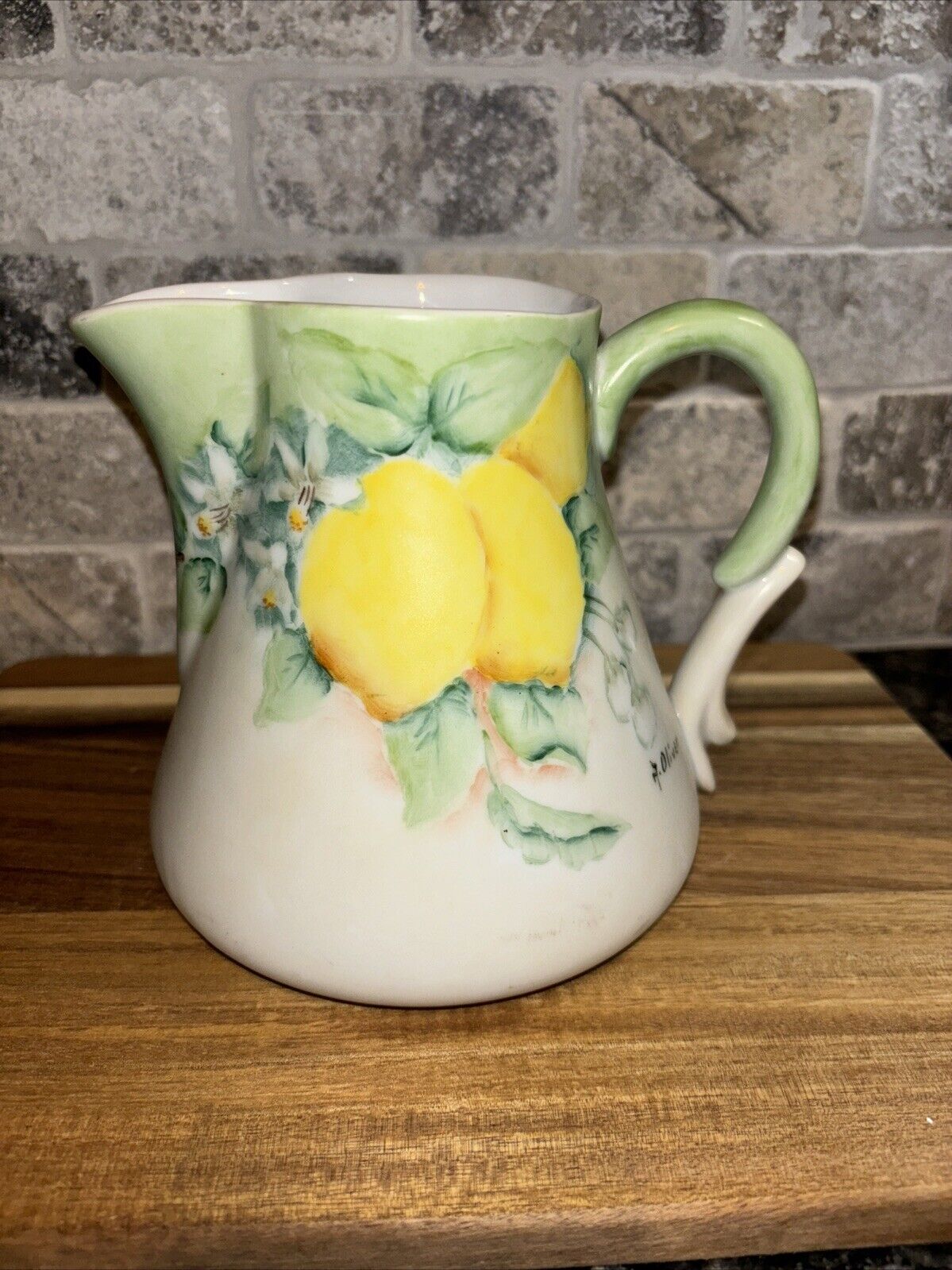 Porcelain pitcher with hand painted lemons and greenery 5 inches tall
