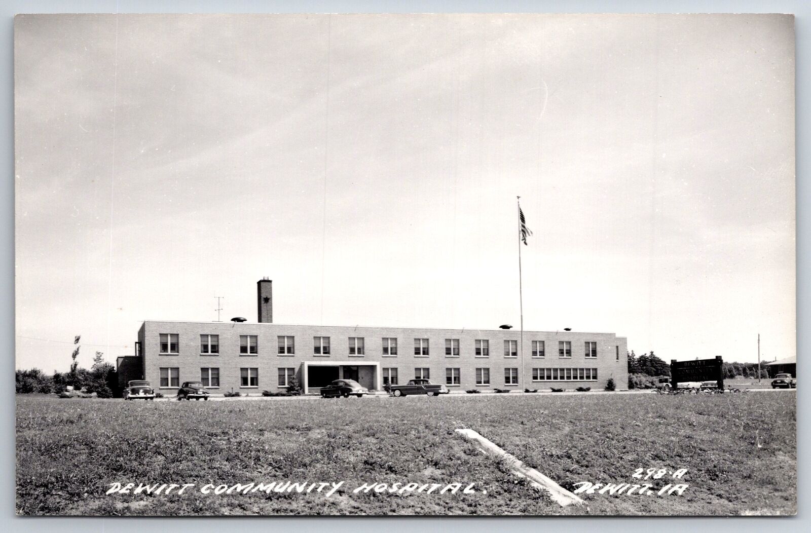 RPPC~DeWitt Iowa~Community Hospital Exterior View W/ Flag~Real Photo Postcard