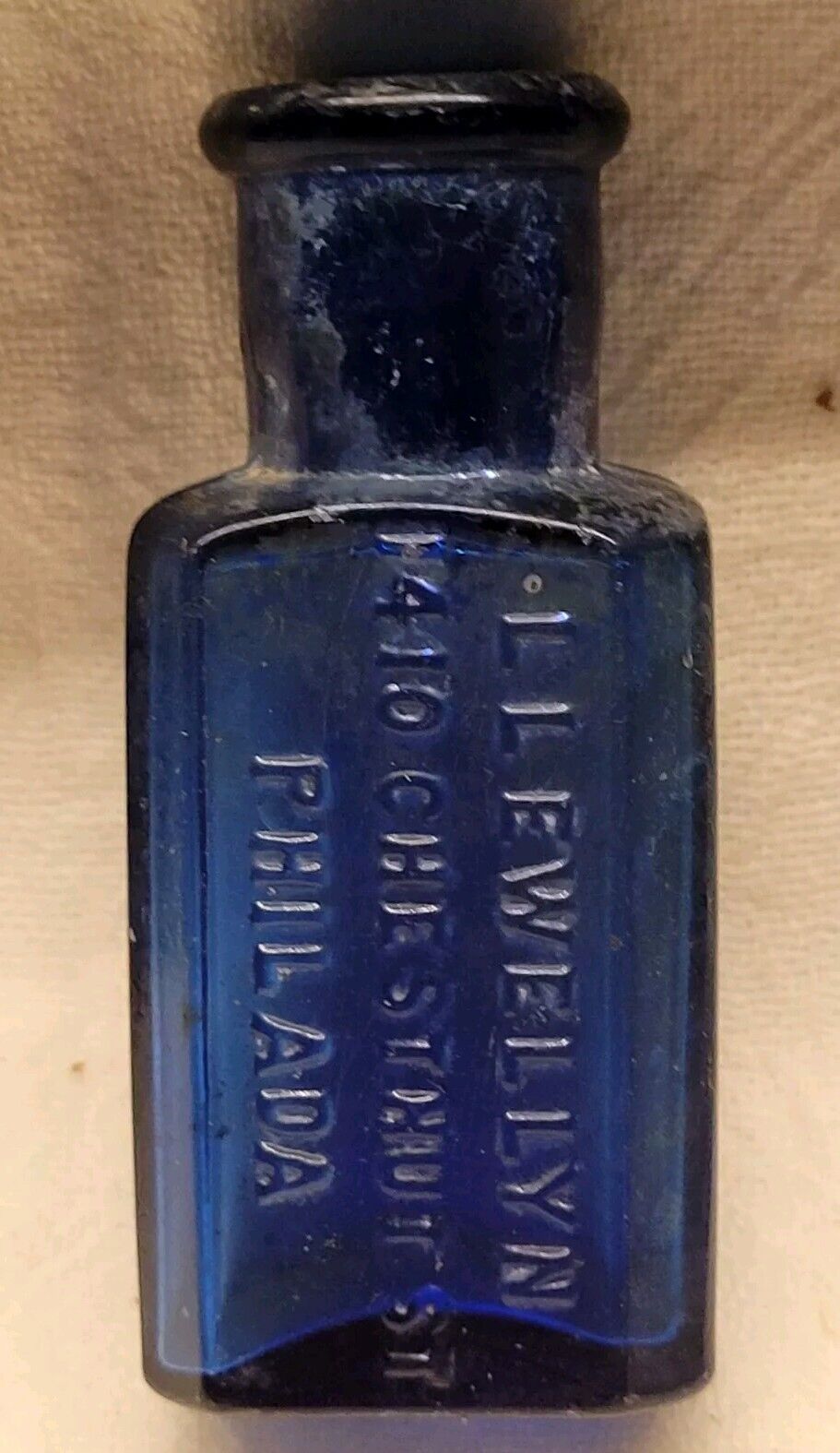 LLEWELLYN PHILADELPHIA PA SMALL COBALT BLUE EMBOSSED DRUG STORE PHARMACY BOTTLE
