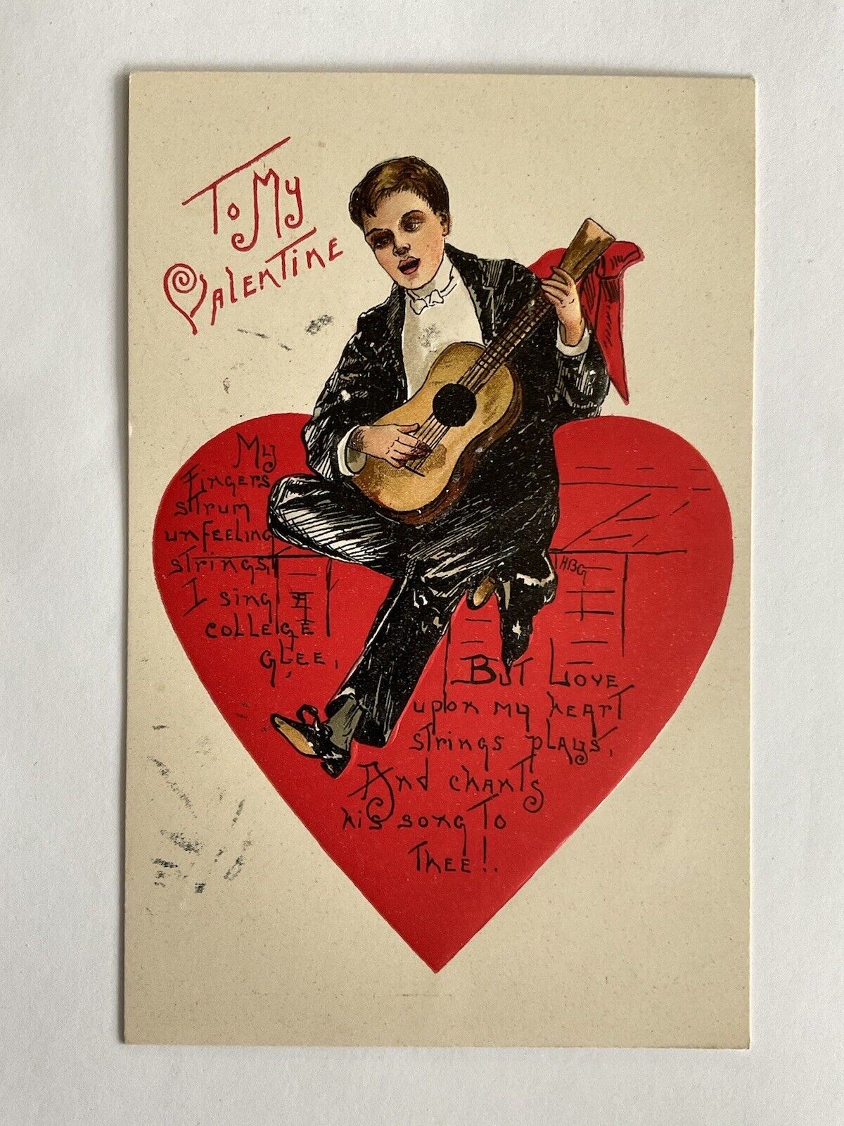 Valentine~HBG~Griggs~man in tuxedo plays guitar~big red heart~college~serie 2218