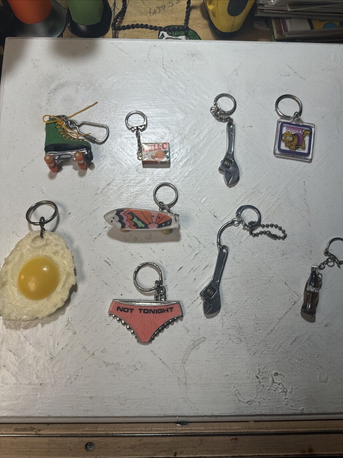Lot Of 9 Various Keychains Jello Egg Garfield Wrench Coca Cola