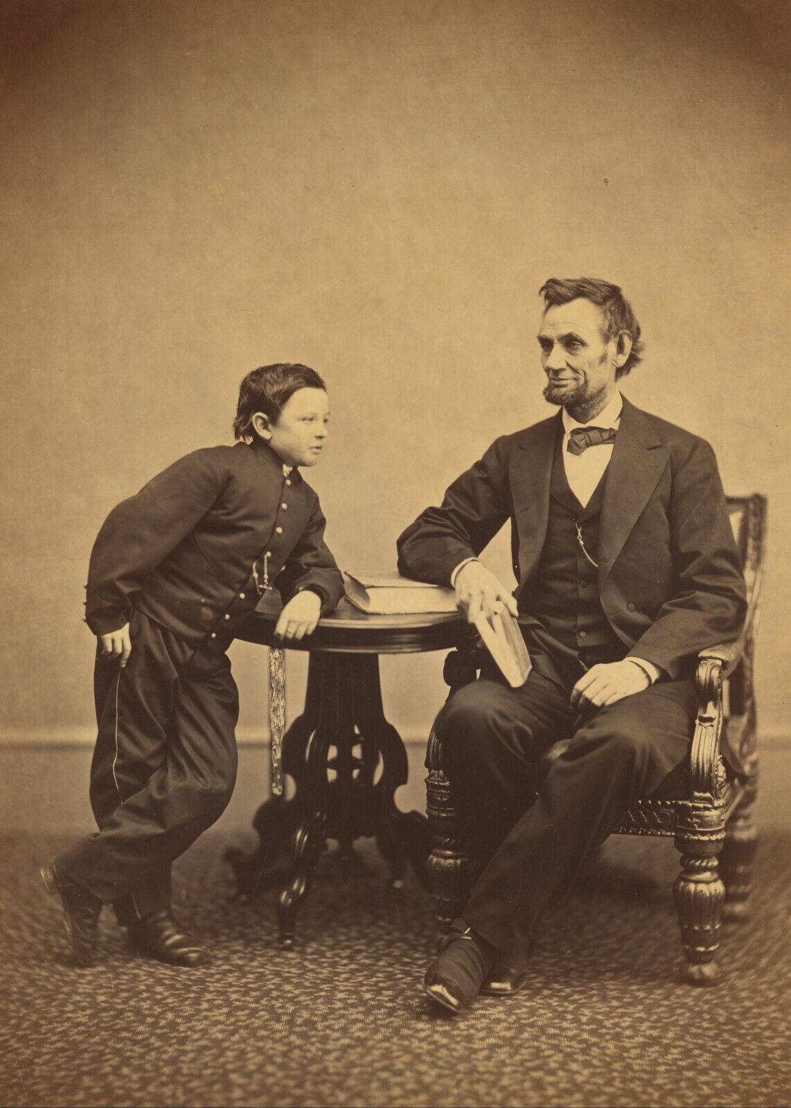PRESIDENT ABRAHAM LINCOLN SEATED WITH HIS SON THOMAS 