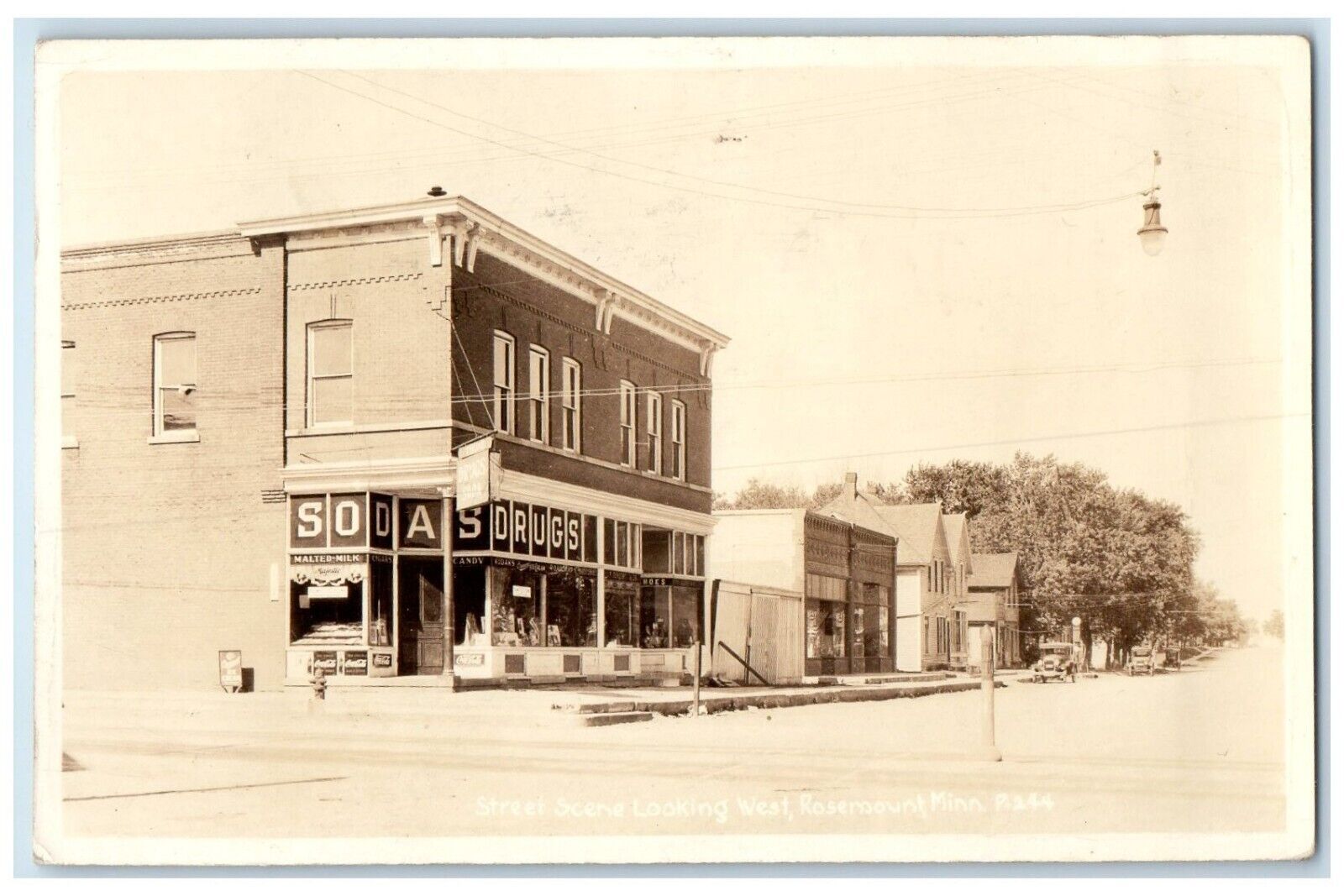 1936 Street Scene Looking West Sodas Drugs Rosemount MN RPPC Photo Postcard