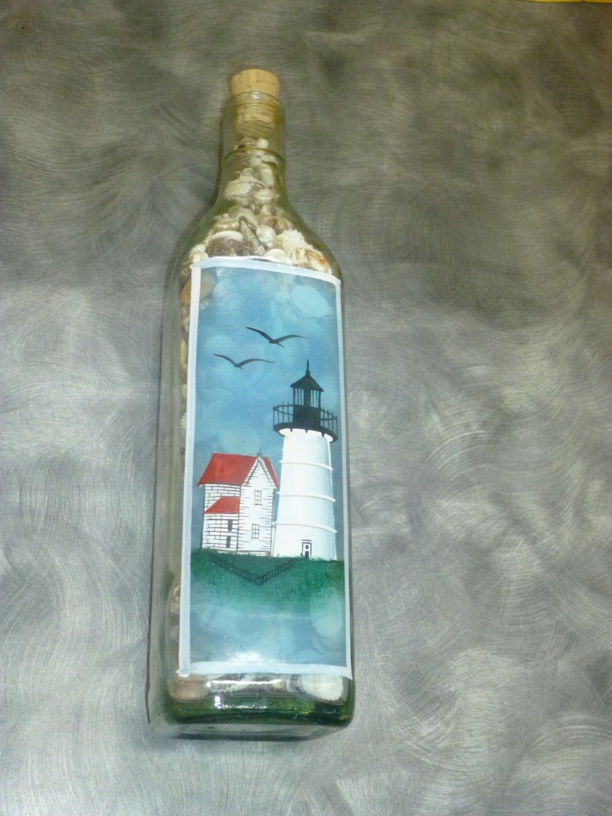 Lovely 750ML Cork Bottle Featuring a Lighthouse, Gulls and over 1000 Sea Shells